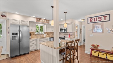 Designed with gathering in mind, this unique lake home was - photo 14
