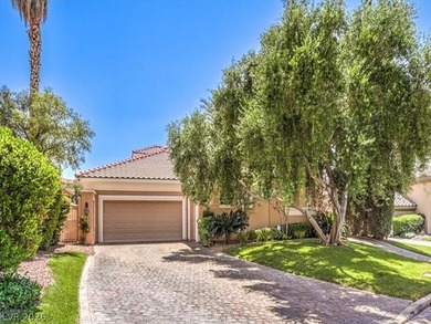 PRICED BELOW COMPS! Located in the prestigious double-gated - photo 1