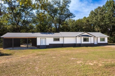 Freshly remodeled, this 4-bedroom, 2-bath home offers the - Lake Home Active Under Contract in Pittsburg, Texas