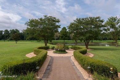 A picturesque tree-lined driveway welcomes you home, setting the - photo 5