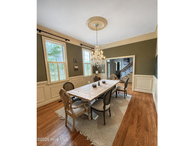 A picturesque tree-lined driveway welcomes you home, setting the - photo 8