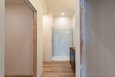 Experience refined lakefront living in this brand-new unit at