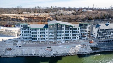 Experience refined lakefront living in this brand-new unit at