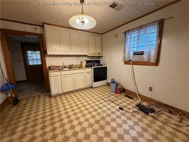 Step into this abundance of potential! This two bed one bath - photo 8