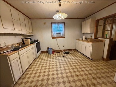 Step into this abundance of potential! This two bed one bath - photo 9
