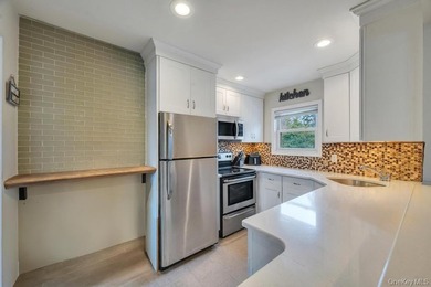 Welcome to this beautifully updated Hi-Ranch located in the - photo 11