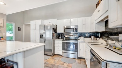 Lakefront living in the heart of Osage Beach at the 21MM! This