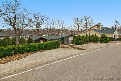 Fully renovated lake home in a prime Lake Ozark location at the - photo 2