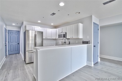 This inviting 3-bed, 2-bath main-level condo sits in The Ledges - photo 8