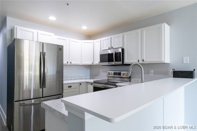 This inviting 3-bed, 2-bath main-level condo sits in The Ledges - photo 9