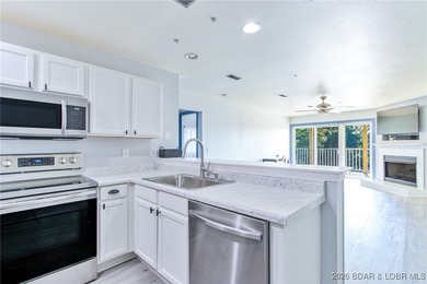 This inviting 3-bed, 2-bath main-level condo sits in The Ledges - photo 10