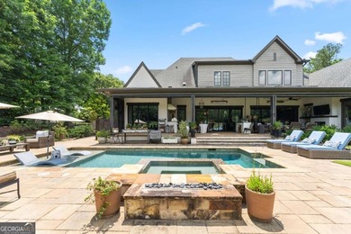 AR Homes built this custom residence around one of Chattahoochee - photo 2