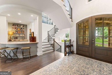 AR Homes built this custom residence around one of Chattahoochee - photo 9