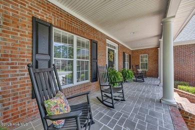 Welcome to this beautifully maintained brick home in the highly - photo 3