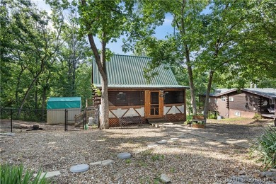Escape to this adorable 2-bed, 2-bath rustic log cabin tucked - photo 1