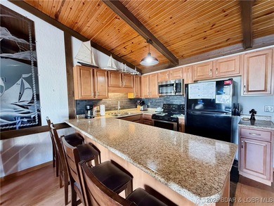 Enjoy lake living at its best in this beautifully maintained