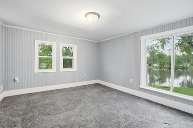 Completely reimagined in 2019, this riverfront retreat blends - photo 16