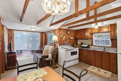 Discover this unique 2-bedroom, 1-bath lakefront cabin offering - photo 12