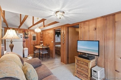 Discover this unique 2-bedroom, 1-bath lakefront cabin offering - photo 16