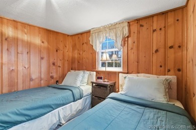 Discover this unique 2-bedroom, 1-bath lakefront cabin offering - photo 20