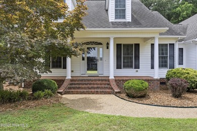 Lovely Cape Cod style home directly across the street from the - photo 2