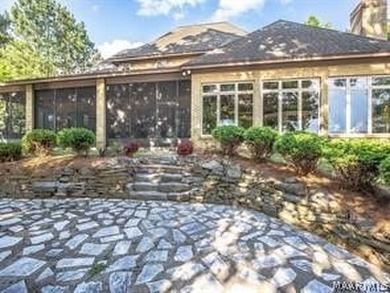 Experience elevated lakefront living on the pristine shores of - photo 2