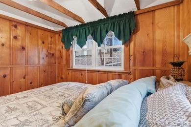 Discover this unique 2-bedroom, 1-bath lakefront cabin offering - photo 24