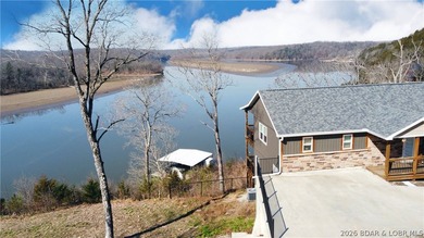 This 3-bedroom, 2.5-bath lakefront home offers over 2,000 square - photo 3