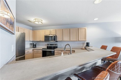 Experience Lake of the Ozarks living at its finest in this - photo 10