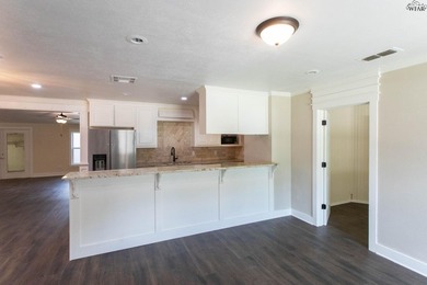 Completely updated 4BR, 2BA home near Lake Wichita! Open floor - photo 3