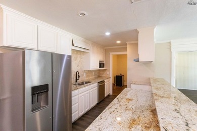 Completely updated 4BR, 2BA home near Lake Wichita! Open floor - photo 8