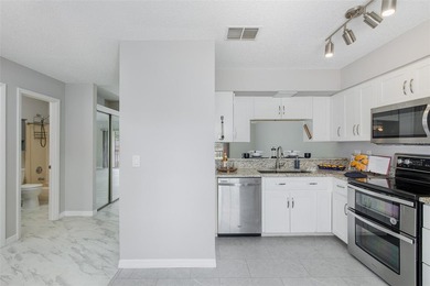 Beautifully UPDATED 2/2, 55+ condo with MODERN UPGRADESpletely - photo 7