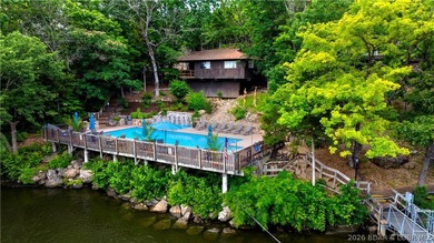 Enjoy treehouse-style living with true lakefront views and all - photo 25