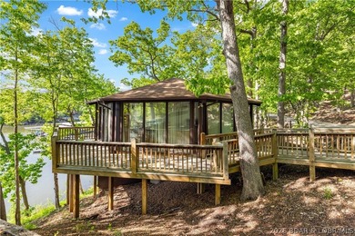 Enjoy treehouse-style living with true lakefront views and all - photo 33