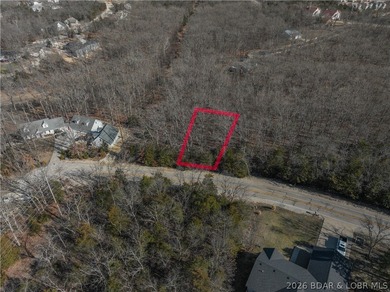 Flat 0.4-acre lot located in Four Seasons POA, offering an - photo 2
