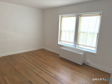This large one bedroom unit is conveniently located in the - photo 3