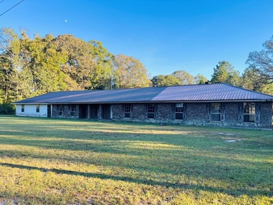 This 5 bedroom, 2 1/2 bath home on 1 acre of land with an - photo 3