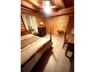 A true Abe Lincoln log home featuring 2 bedrooms, one up, one - photo 12
