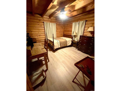 A true Abe Lincoln log home featuring 2 bedrooms, one up, one - photo 13