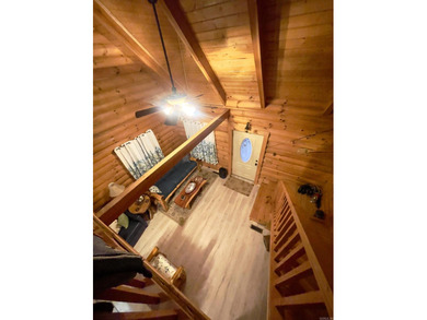 A true Abe Lincoln log home featuring 2 bedrooms, one up, one - photo 15