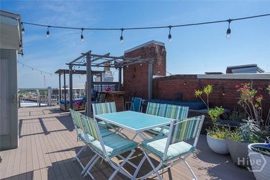 Perched above Savannah's iconic River Street next to the - photo 33