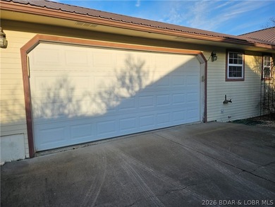 This lakefront homes has many pluses: one level living, attached - photo 8