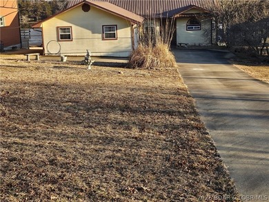 This lakefront homes has many pluses: one level living, attached - photo 9