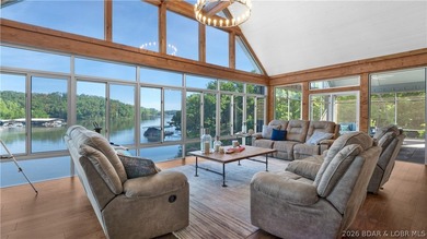 Experience luxury lakefront living on a scale rarely found at - photo 2