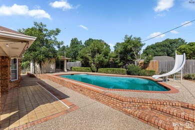 Welcome to this charming 3-bedroom, 2-bath home in the highly - photo 3
