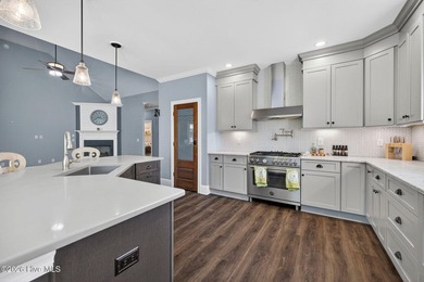 Situated on a premium lot with a tranquil pond and a lighted - photo 10