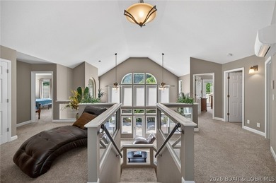This 5-bedroom, 3.5-bath lakefront home in Four Seasons is - photo 5