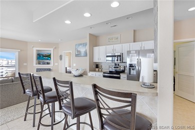 This well-positioned 5th-floor end-unit condo offers expansive