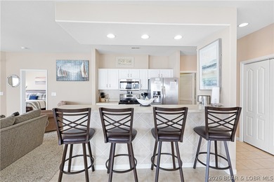 This well-positioned 5th-floor end-unit condo offers expansive