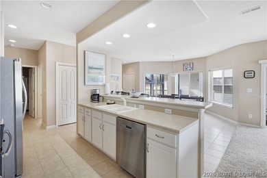 This well-positioned 5th-floor end-unit condo offers expansive